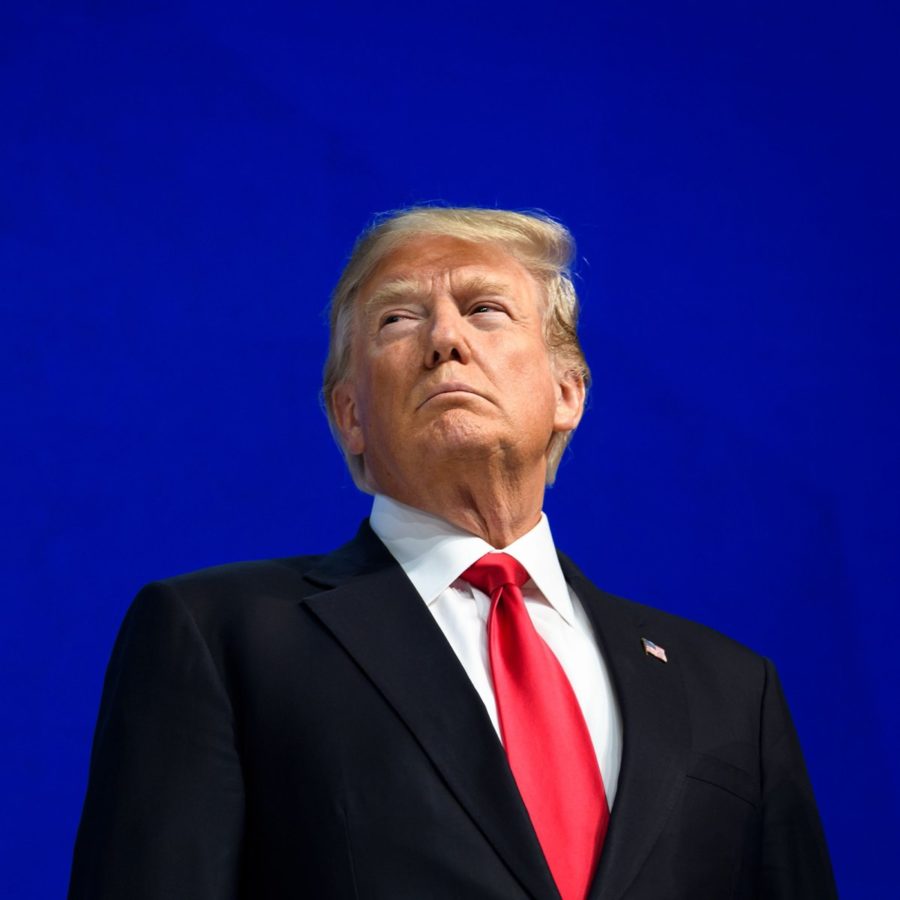 TOPSHOT+-+US+President+Donald+Trump+looks+on+before+delivering+a+speech+during+the+World+Economic+Forum+%28WEF%29+annual+meeting+on+January+26%2C+2018+in+Davos%2C+eastern+Switzerland.++%2F+AFP+PHOTO+%2F+Fabrice+COFFRINI++++++++%28Photo+credit+should+read+FABRICE+COFFRINI%2FAFP%2FGetty+Images%29