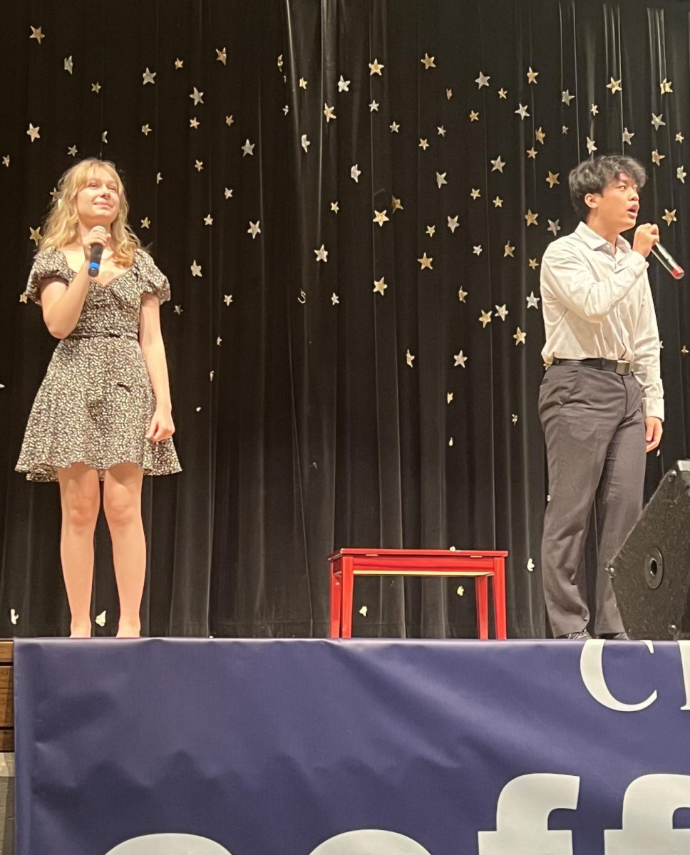 Junior Sofia Paoletti (left) and senior Andy Wu (right) performing at Coffee House
