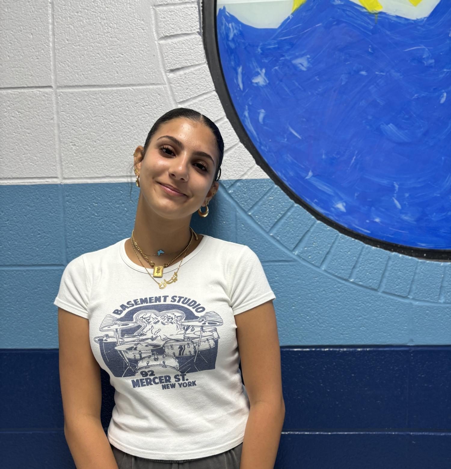 Junior Laila Younes works as a coach at Olympia Gymnastics.