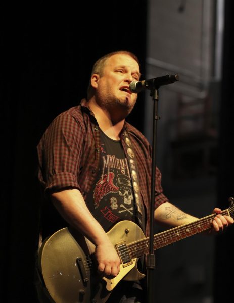 Professional communications teacher and Rock Club sponsor Jeffrey Stirl took the stage with his guitar and amplifier to sing Poison's "Something to Believe In".