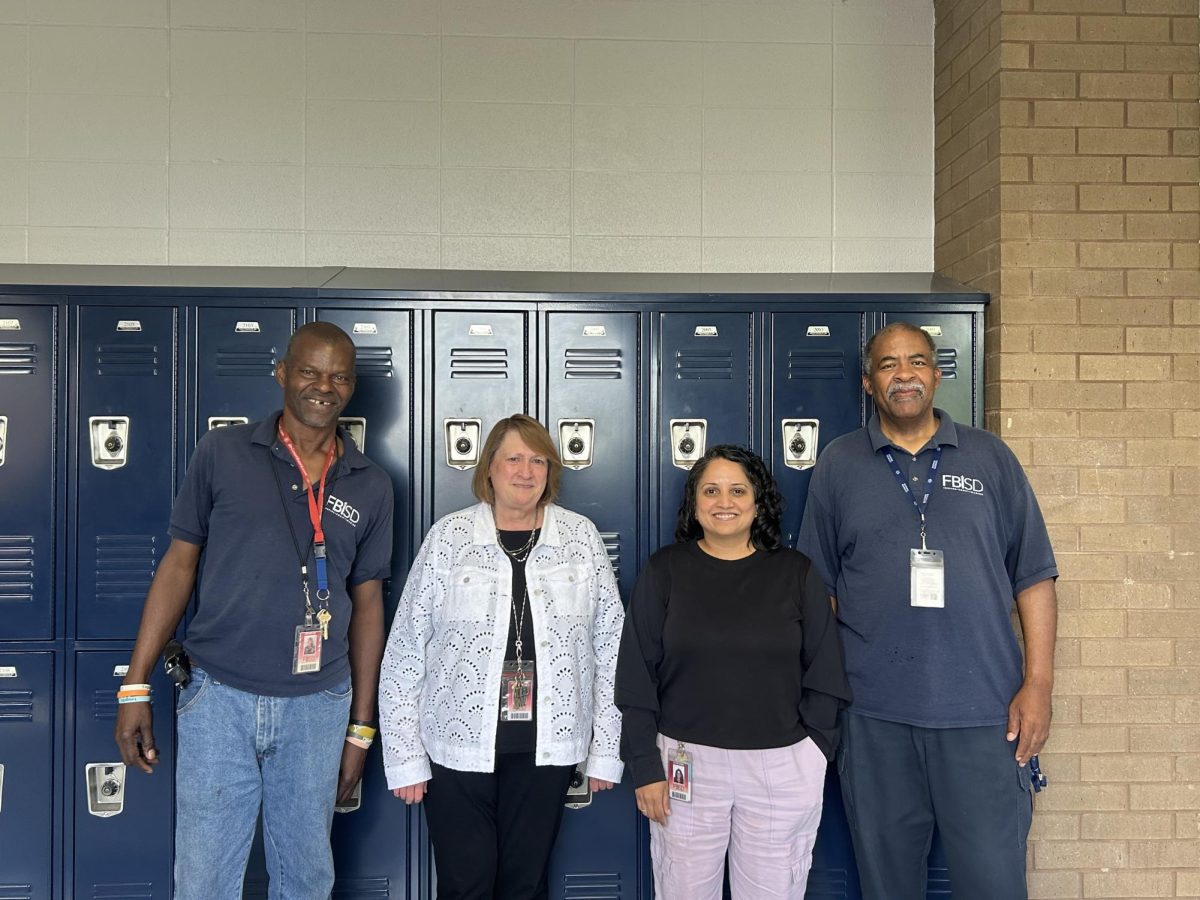 Custodian Arthur Cox (far left) advises students to finish anything they sign up for and get back up if they fail.