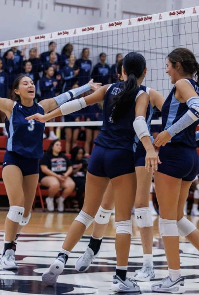 Bella Casal, team captain, celebrating with her teammates after scoring a point.