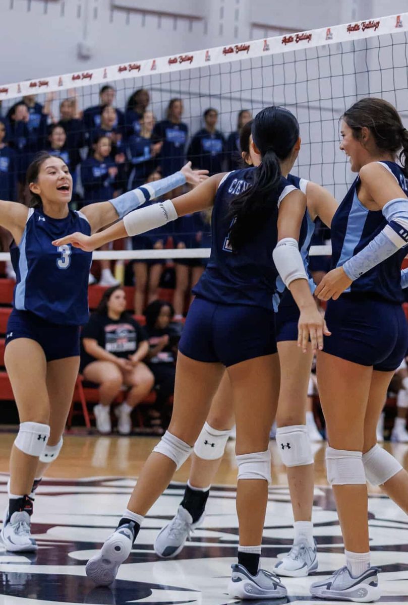Bella Casal, team captain, celebrating with her teammates after scoring a point.
