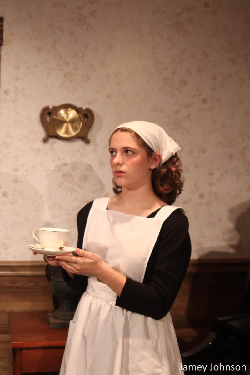 Clara getting tea for the Blisses (Kaelyn Kot).