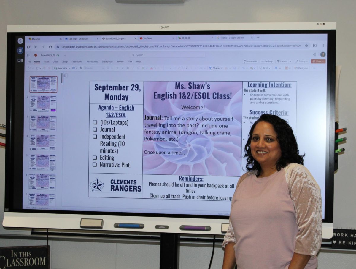 ESL teacher Anitra Shaw setting up her classroom's smartboard.