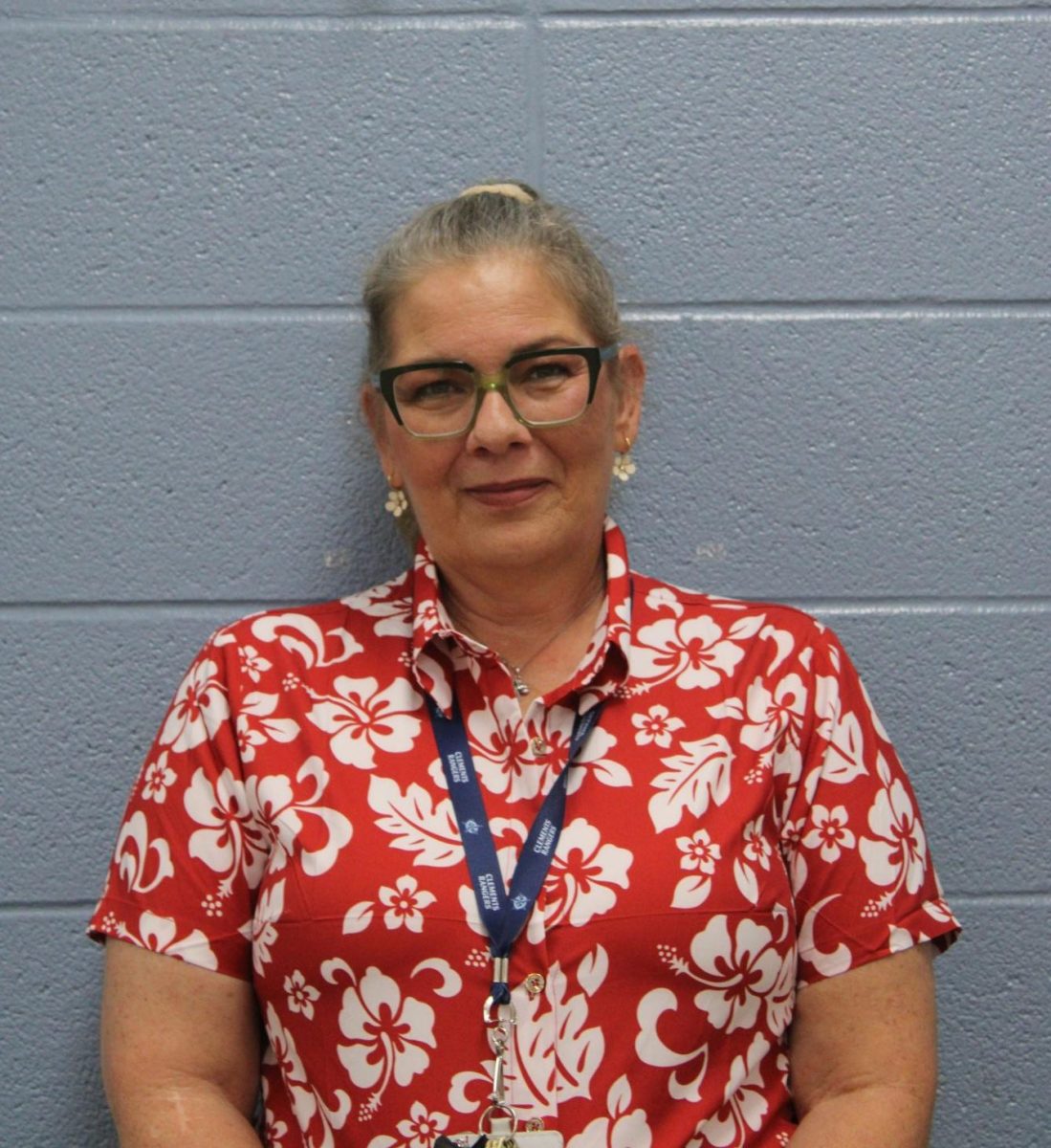 Principles of health science and health science theory teacher Staci Mikeska against the backdrop of her classroom.