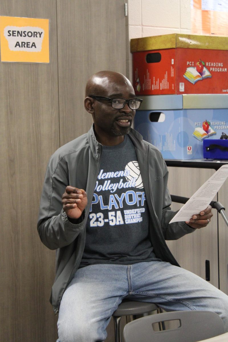 Special education teacher Eno Usanga rehearsing for the SAILS Spelling Bee.