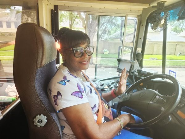 Bus driver Mary Haynes behind the wheel of her school bus after she finishing her route.