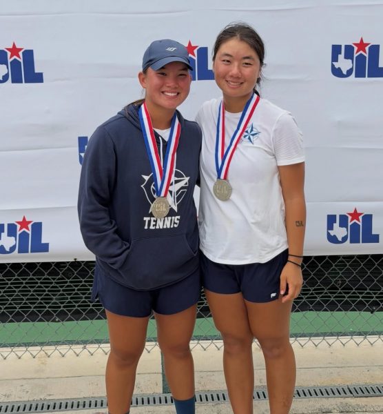 Freshman Natasha Rosseland (left) and partner junior Isabella Young (right) with their medals after achieving second place at the state tournament.