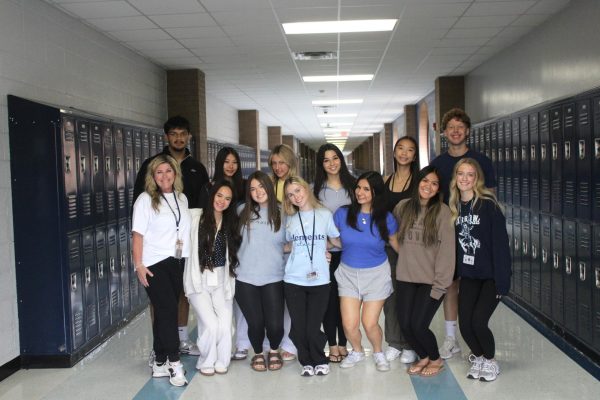 The 2026 yearbook staff standing together for a hallway group photo.