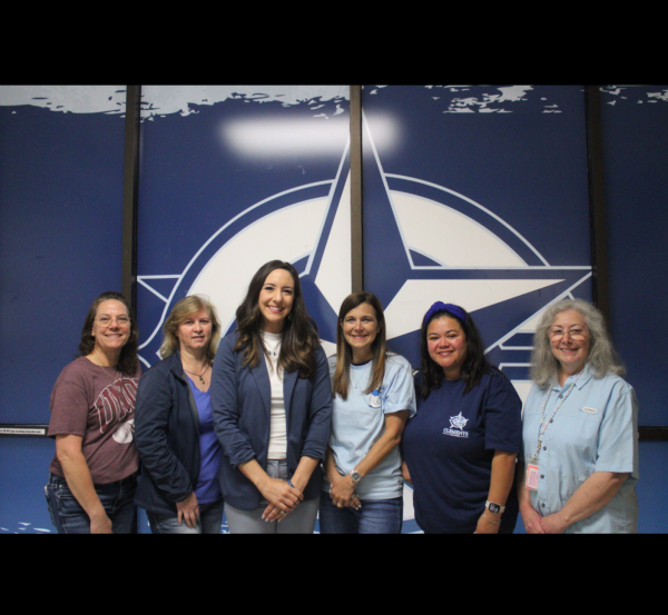 The front office staff grouped in front of the Clements' star.